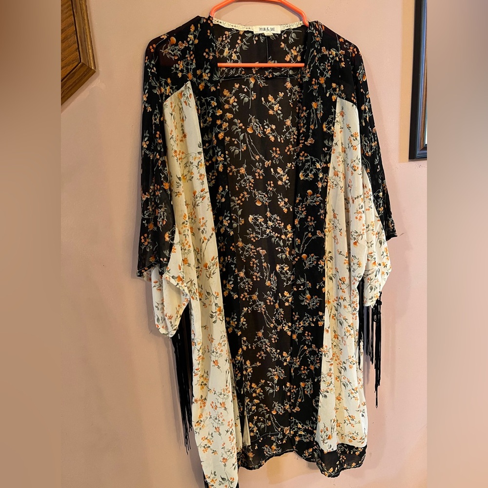 Taylor & Sage boho inspired, floral robe with black fringe from sleeves.